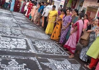 Admiring the kolams