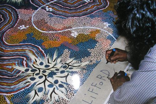 1994 Posum Dreaming at Nappery being signed by Clifford Possum