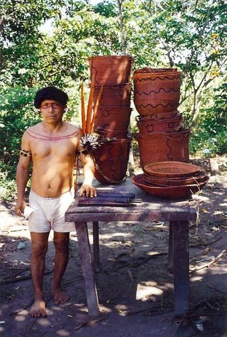 Yanomamo chief selling baskets
